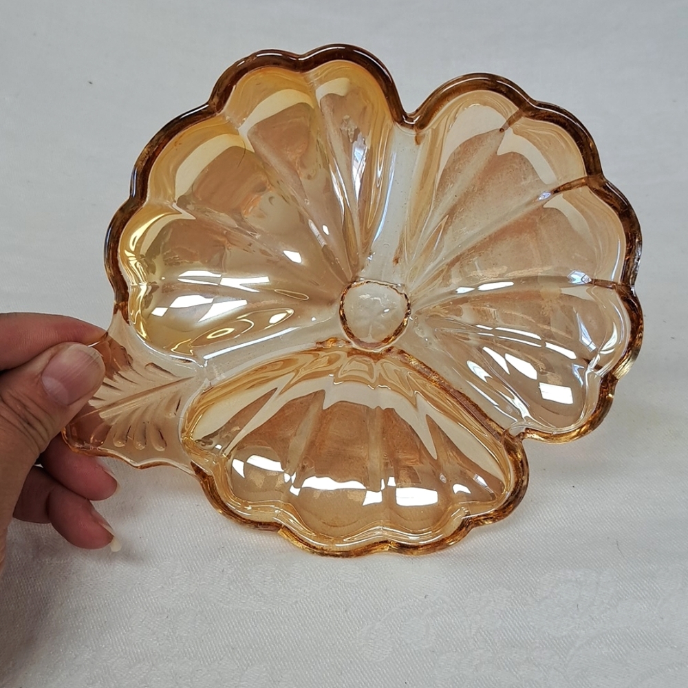 Vintage hibiscus-shaped marigold carnival glass dish by"Jeanette Glass"